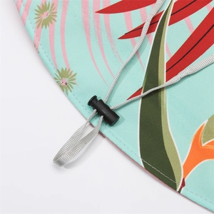 Detail of floral print sun hat with adjustable grey windproof rope and toggle