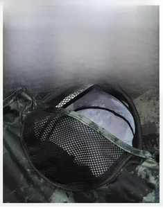 Detail of breathable camouflage face mask with mesh fabric for outdoor fishing hat