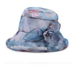 Detail view of the floral blue sun hat featuring a 3D fabric flower and breathable fabric