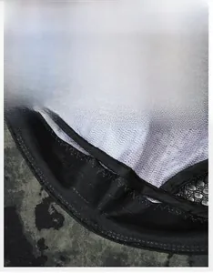 Close-up of camouflage fishing hat featuring widened sweatband and breathable mesh lining