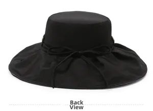 Close-up of black breathable sun hat featuring wide pleated brim and ribbon bow back view