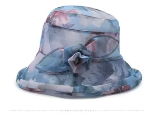 Close-up of elegant floral sun hat featuring 3D fabric flower and breathable mesh detail