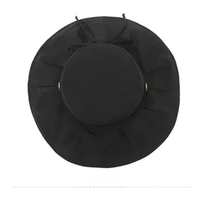 Top view of black wide brim sun hat with matching bow tie and gold buckle detail