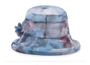 Detailed view of blue floral chiffon bucket hat with decorative 3D flower ornament
