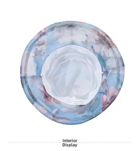 Internal detail of summer floral sun hat featuring breathable white mesh lining and tags