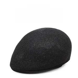 Detail of breathable black mesh fabric on a stylish summer ivy cap for sun protection