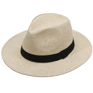 Classic woven beige straw cowboy hat with black ribbon band and wide brim for sun protection