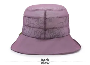 Back view of a purple sun hat featuring gray floral patterns and a gold leaf charm