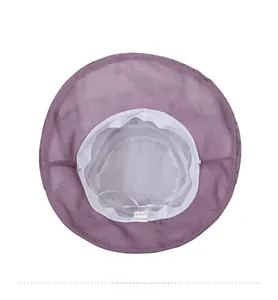 Detail of purple sun hat featuring breathable white mesh lining and interior stitching