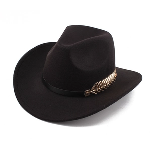 Detail of black felt fedora hat with golden leaf accent on a leather band
