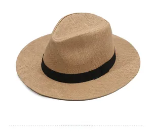Detailed top view showing fine weaving texture and black band on classic straw sun hat