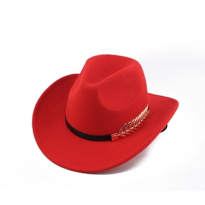Detail of red wool felt cowboy hat with black band and golden leaf metal ornament