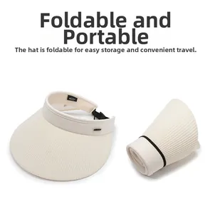 Detailed view of beige foldable straw sun visor showing both expanded and rolled-up storage