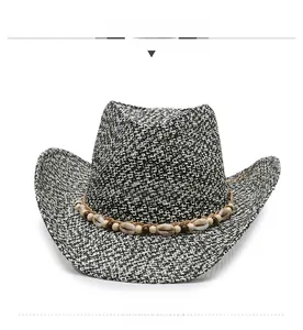 Front view of black and white woven cowboy hat with shells and wooden beads trim
