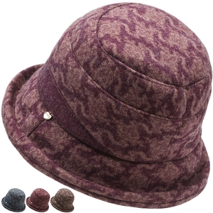 Detail of winter cloche hat with retro marble texture and silver LOVE metal buckle