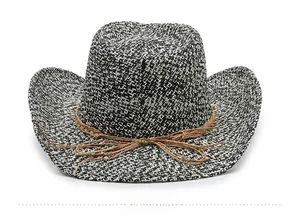 Detailed view of bicolor woven straw texture and brown rope band on cowboy hat