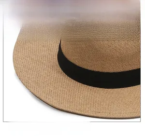 Close-up of the fine straw weave and black ribbon detail on this wide brim sun hat