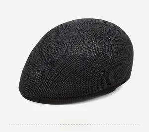 Detail view of the black breathable mesh knit texture on a lightweight ivy sun cap