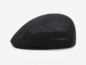 Detail view of the breathable mesh texture on this black straw ivy cap for sun protection