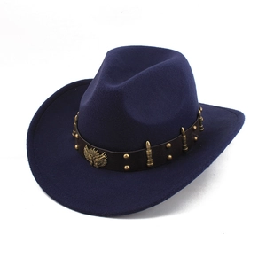 Detailed macro view of navy wool felt hat featuring gold rivets and winged badge decoration