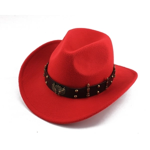 Close-up of red felt cowboy hat with eagle emblem and metal stud detailing