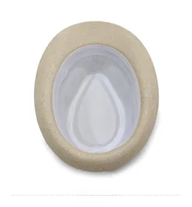 Detailed interior view of a beige woven fedora with white fabric lining and sweatband