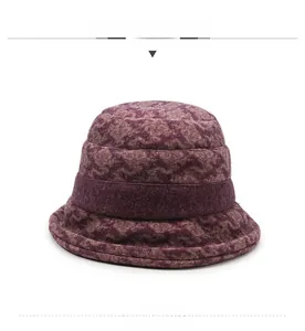 Detailed close-up showing the dark purple jacquard texture of the women bucket hat