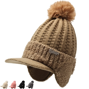 Detail of knit winter hat featuring ear flaps, fleece lining, and rhinestone decor