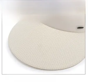 Close-up of woven straw sun hat brim with metallic logo detail on the side band