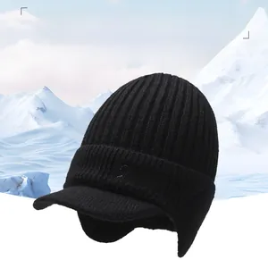 Detail of black winter knit hat featuring warm fleece lining and sport embroidery