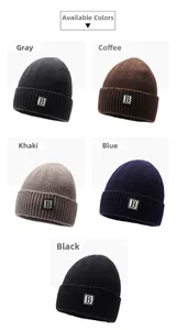 Detail view of ribbed knit beanies with square letter B patches in five colors