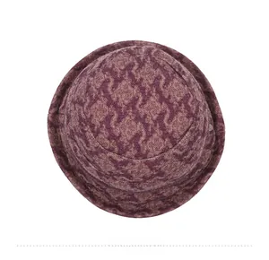 Top down detail of purple jacquard knit cloche hat showing premium textile texture