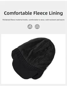 Close-up of thick fleece lining and warm knitted texture on a black winter earflap hat