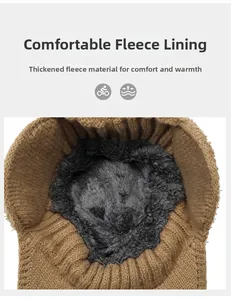 Detailed macro view of the thick gray fleece lining inside a brown winter knit beanie