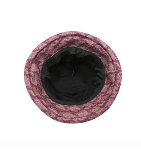 Detail view of the black knit lining and edge stitching of the purple cloche hat