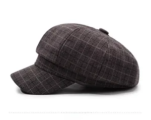 Side view of dark brown plaid newsboy cap with vintage wool texture and decorative button