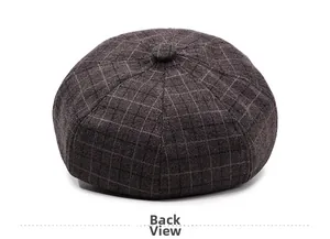 Detailed back view of a vintage plaid woolen newsboy hat in dark brown and coffee tones