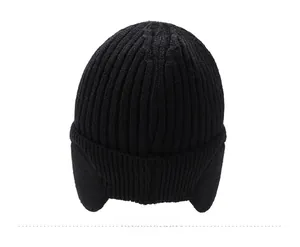 Rear view of black ribbed knit winter beanie with protective ear flaps for cold weather
