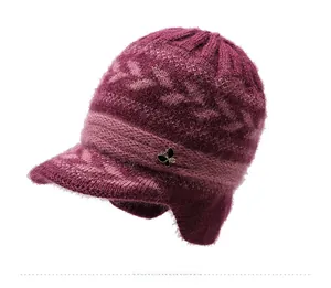 Detailed knit texture and black butterfly metal decor on a magenta winter earmuff hat