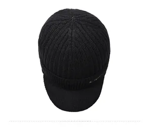Top view of thick black knit visor beanie showing ribbed texture and warm lining