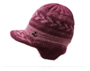 Detail view of the deep purple knit winter hat with mohair texture and metal bow decor