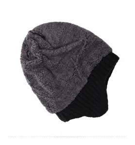Close-up of winter knit beanie showing thick grey faux fleece lining for warmth