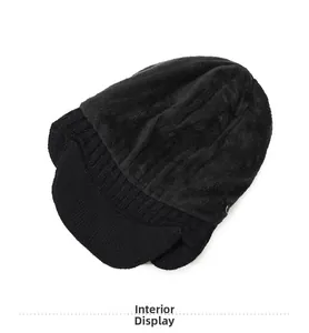 Detailed view of the thick fleece lining and warm knitted texture of the men's winter hat