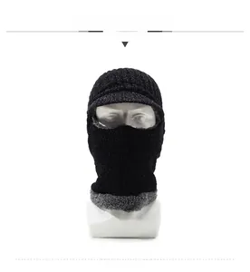 Front detail of black knit balaclava featuring a warm grey fleece lining and short brim