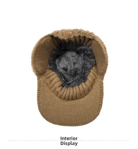 Detailed view of the warm fleece lining inside the brown jacquard knitted winter hat