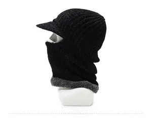 Detail of windproof knit hat for men with warm grey fleece lining and sun visor