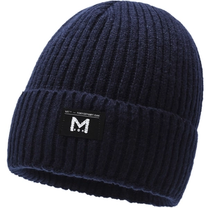 Close-up of deep blue ribbed knit beanie with central embroidered logo and warm texture