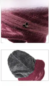 Detailed close-up showing thick grey fleece lining and purple knit texture of the winter hat
