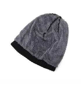Detail showing the thick grey plush lining of the knitted winter beanie for warmth