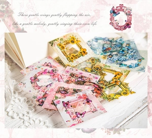 Macro detail of vintage floral frame and butterfly PET stickers for journaling